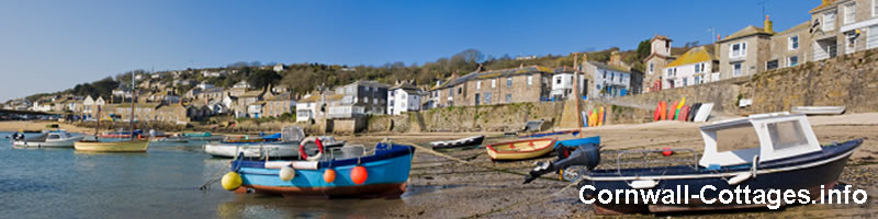 Image of a cornish fishing village with Cornwall Cottages site name